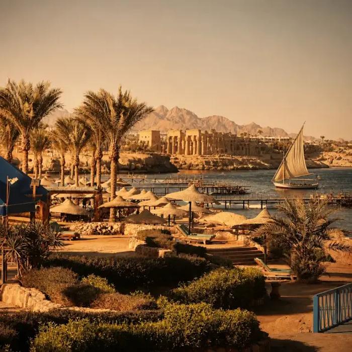 Felucca sailing past Nile temple landscape – Egypt cultural tour